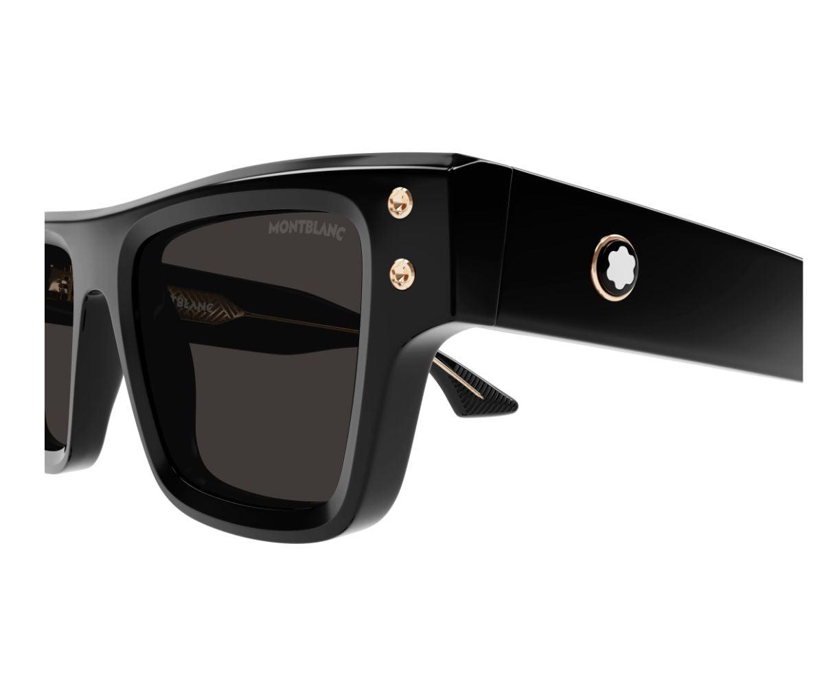 Black sunglasses with gold accents on a white background