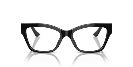 Black cat-eye glasses on a reflective surface with a black background