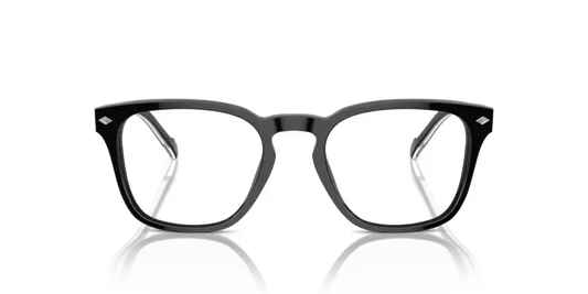 Black-framed eyeglasses on a reflective surface with a black background