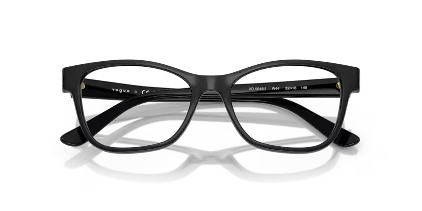 Black eyeglasses with 'vogue' branding on a clear background