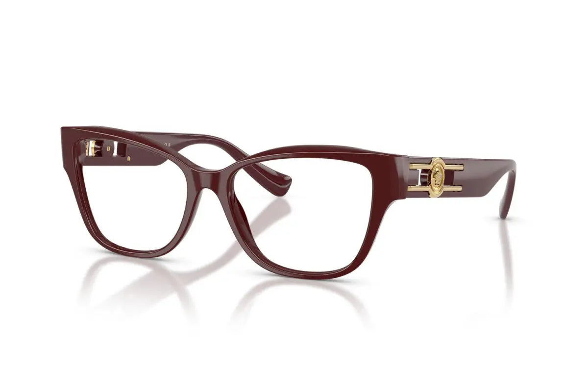 Brown cat-eye glasses with gold accents on a white background