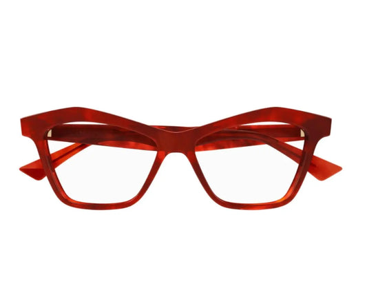 Red eyeglasses on a white background