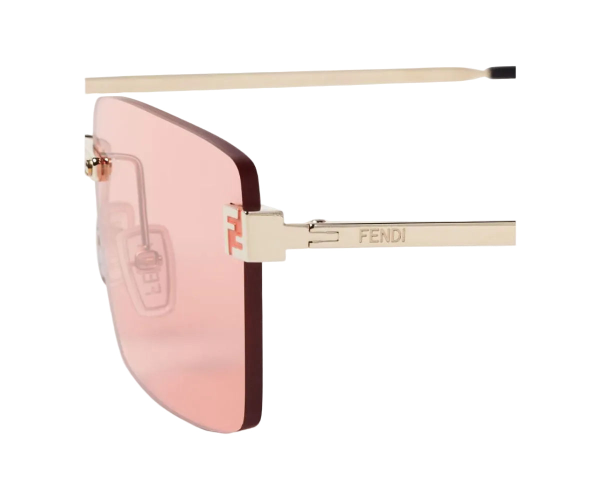 Sunglasses with pink lenses and gold frame on a white background