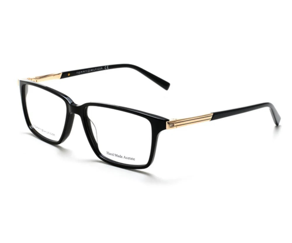 Black and gold eyeglasses on a white background