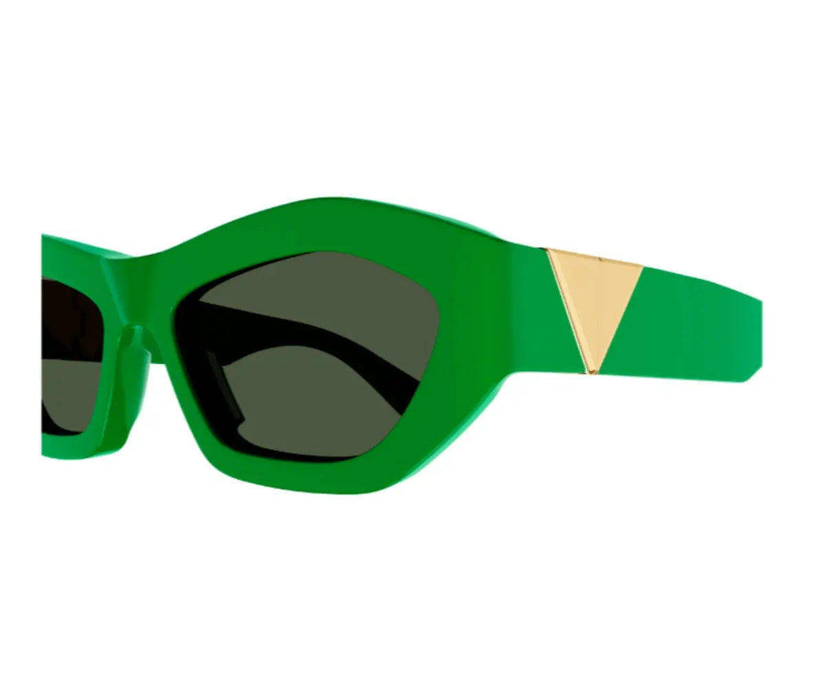 Green sunglasses with a gold accent on a white background