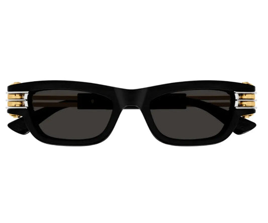 Black sunglasses with gold accents on a white background