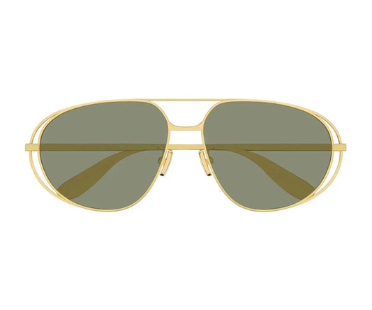 Aviator sunglasses with gold frame and green lenses on a white background