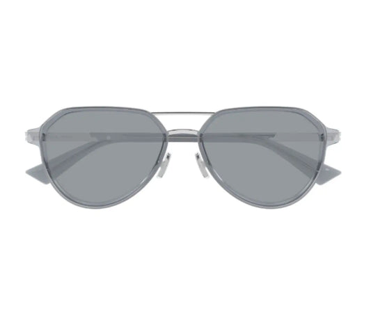 Sunglasses with a silver frame and dark lenses on a white background