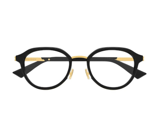 Black and gold eyeglasses on a white background