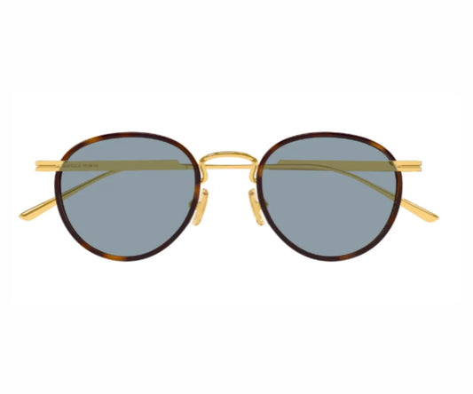 Round sunglasses with gold frame and dark lenses on a white background