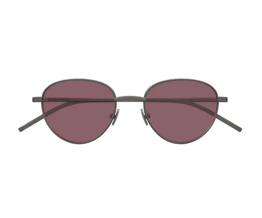 Sunglasses with round lenses and dark frames on a white background