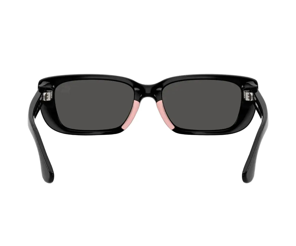 Black sunglasses with dark lenses on a white background