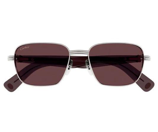 Sunglasses with brown lenses and silver frames on a white background