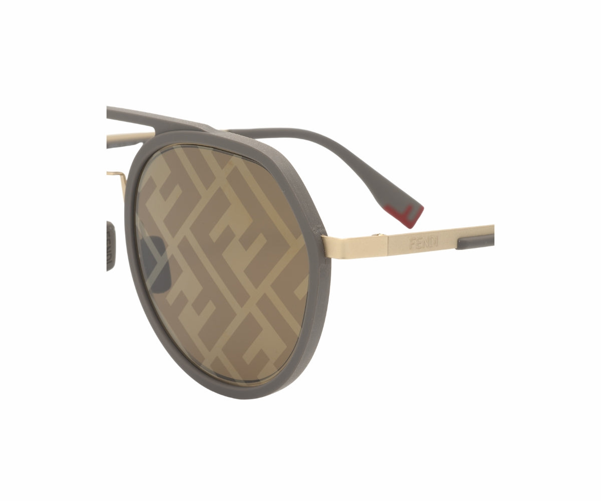 Sunglasses with a brand logo on the lens against a white background