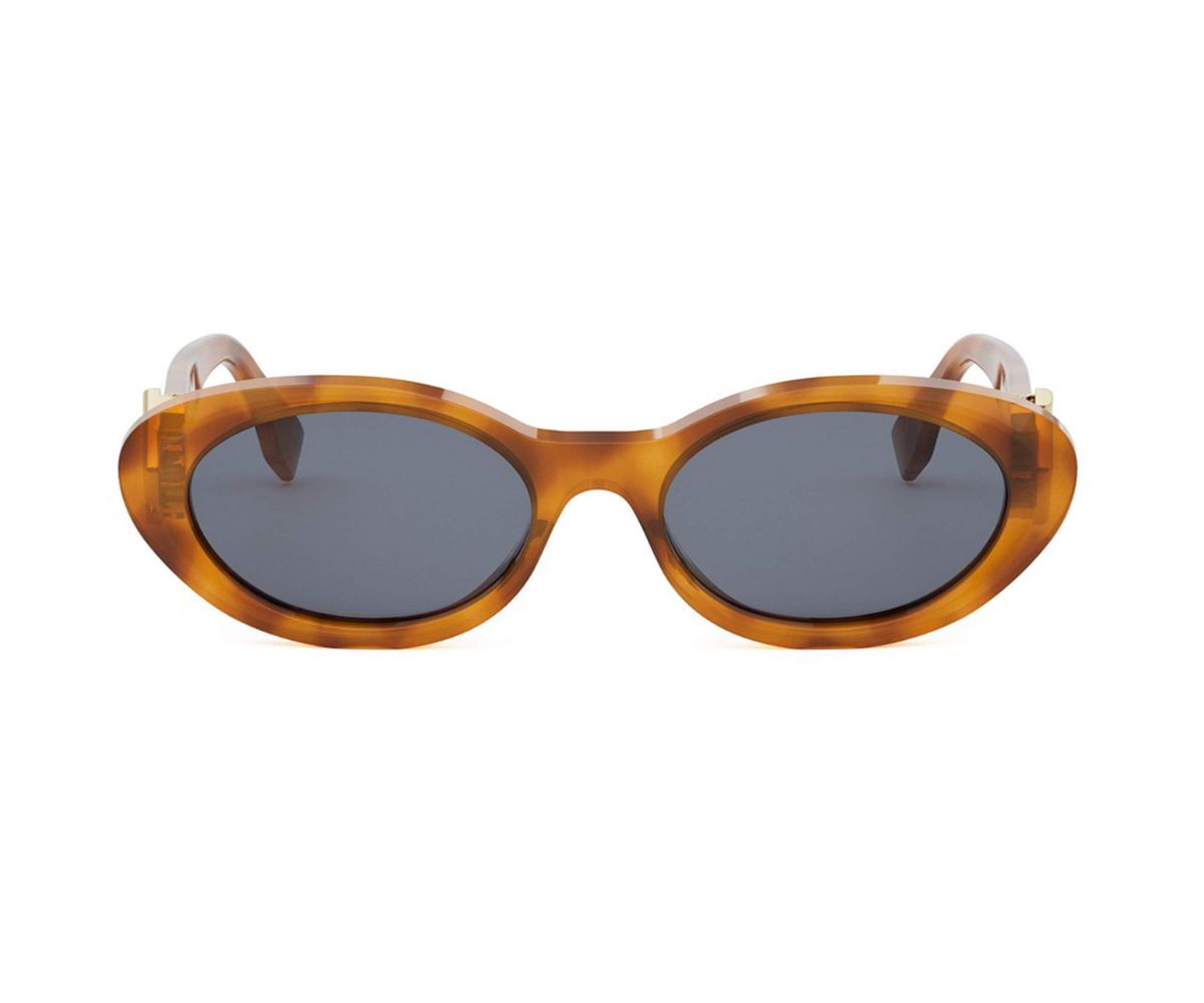 Sunglasses with tortoiseshell frame and dark lenses on a white background