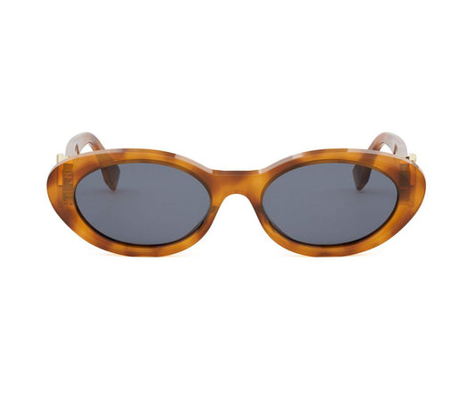 Sunglasses with tortoiseshell frame and dark lenses on a white background