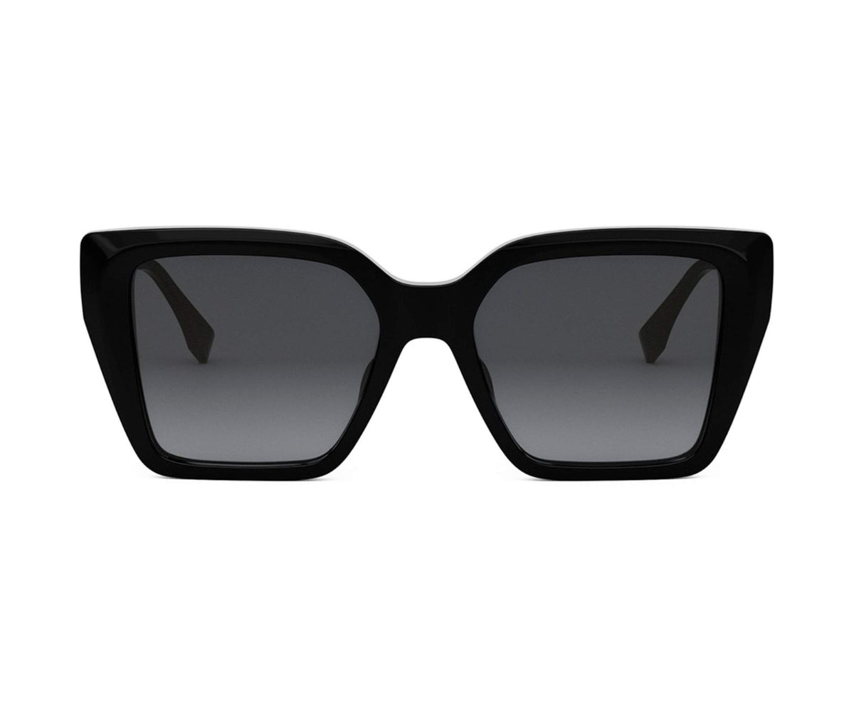 Black sunglasses with dark lenses on a white background