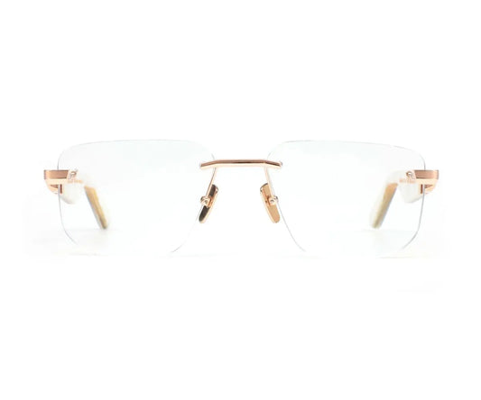 Clear eyeglasses with gold frames on a white background