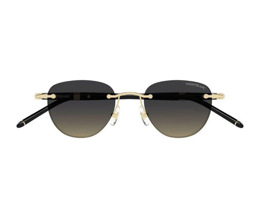 Sunglasses with black gradient lenses and gold frames on a white background