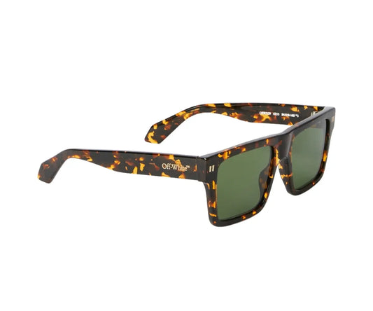 Sunglasses with tortoiseshell frame and green lenses on a white background