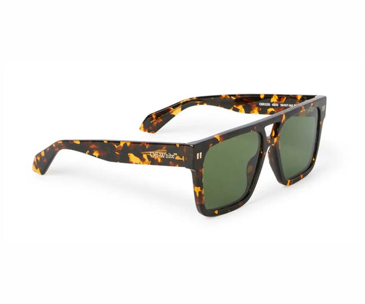 Sunglasses with tortoiseshell frame and green lenses on a white background