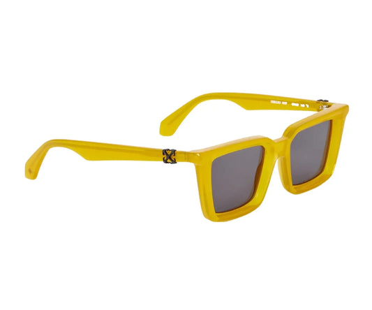 Yellow sunglasses with dark lenses on a white background