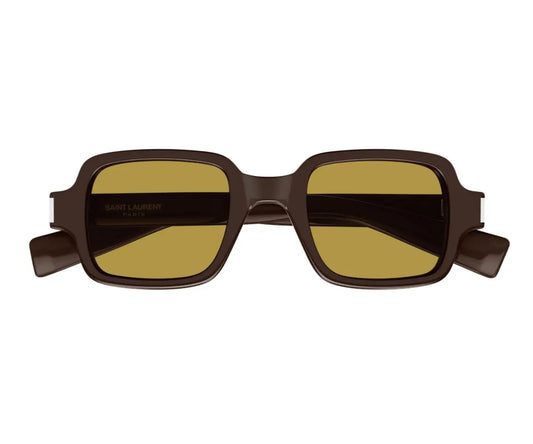 Sunglasses with brown frame and yellow-tinted lenses on a white background