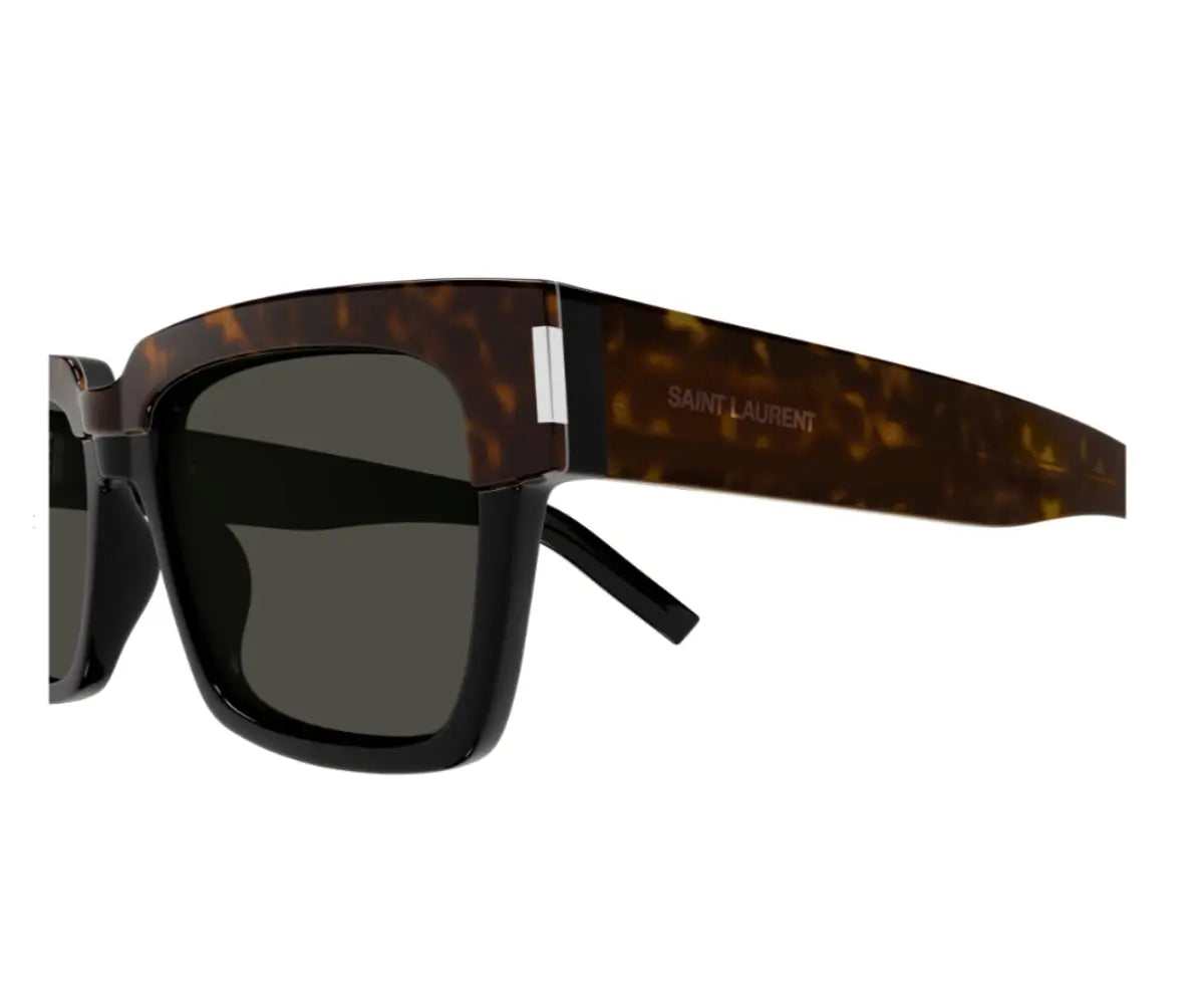 Sunglasses with tortoiseshell frame and dark lenses on a white background