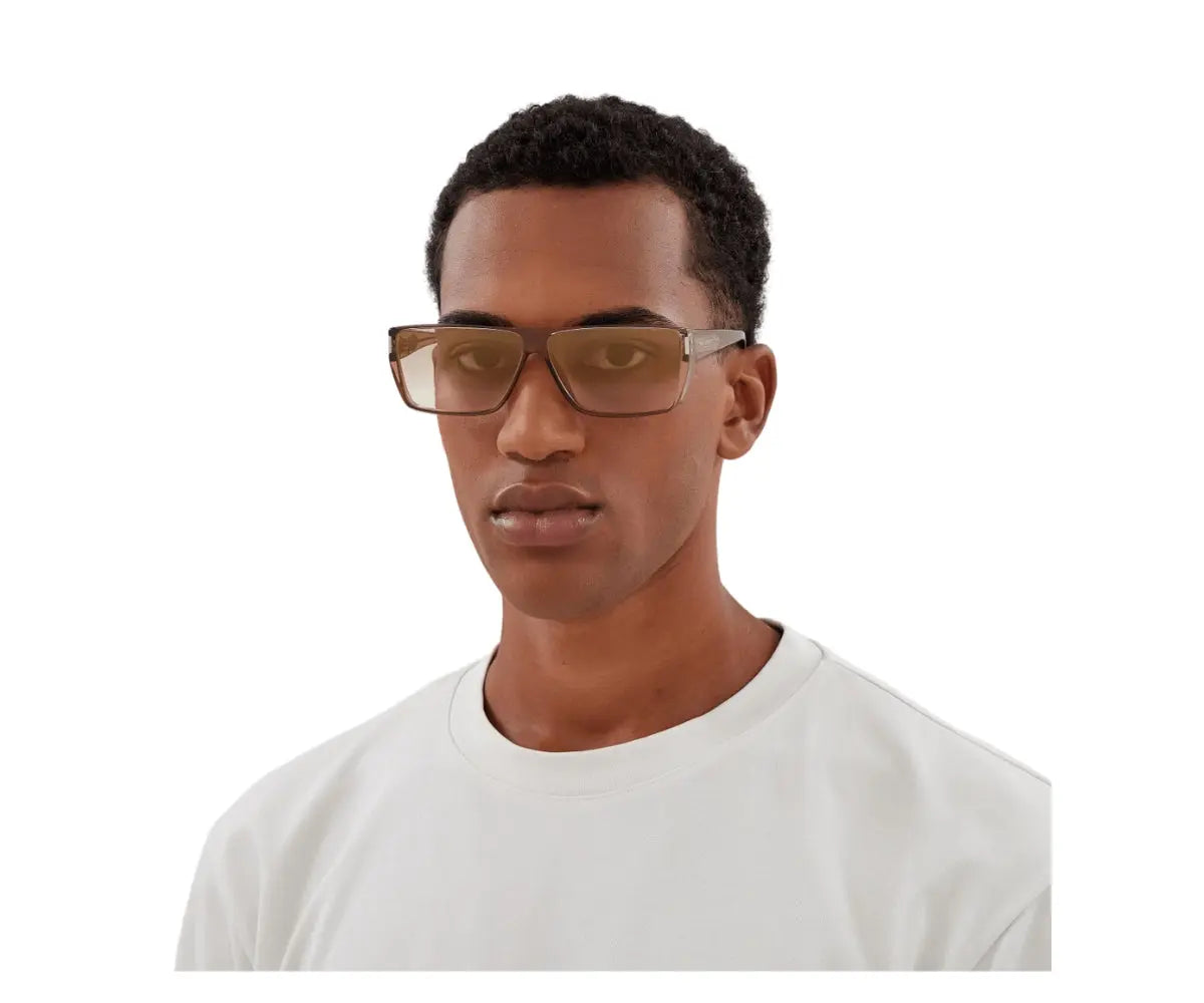 Man wearing glasses and a white shirt on a white background