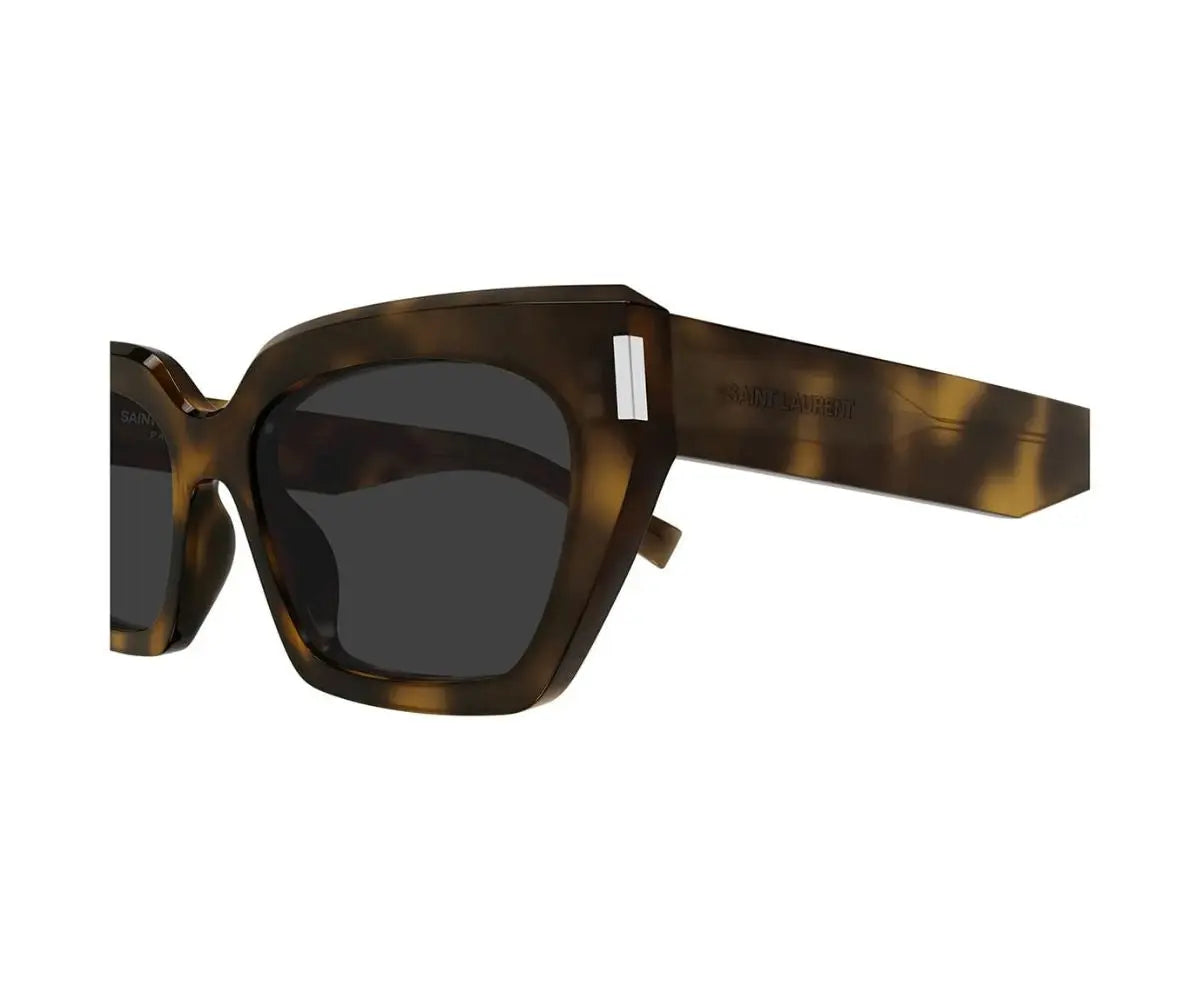 Sunglasses with tortoiseshell frame and dark lenses on a white background