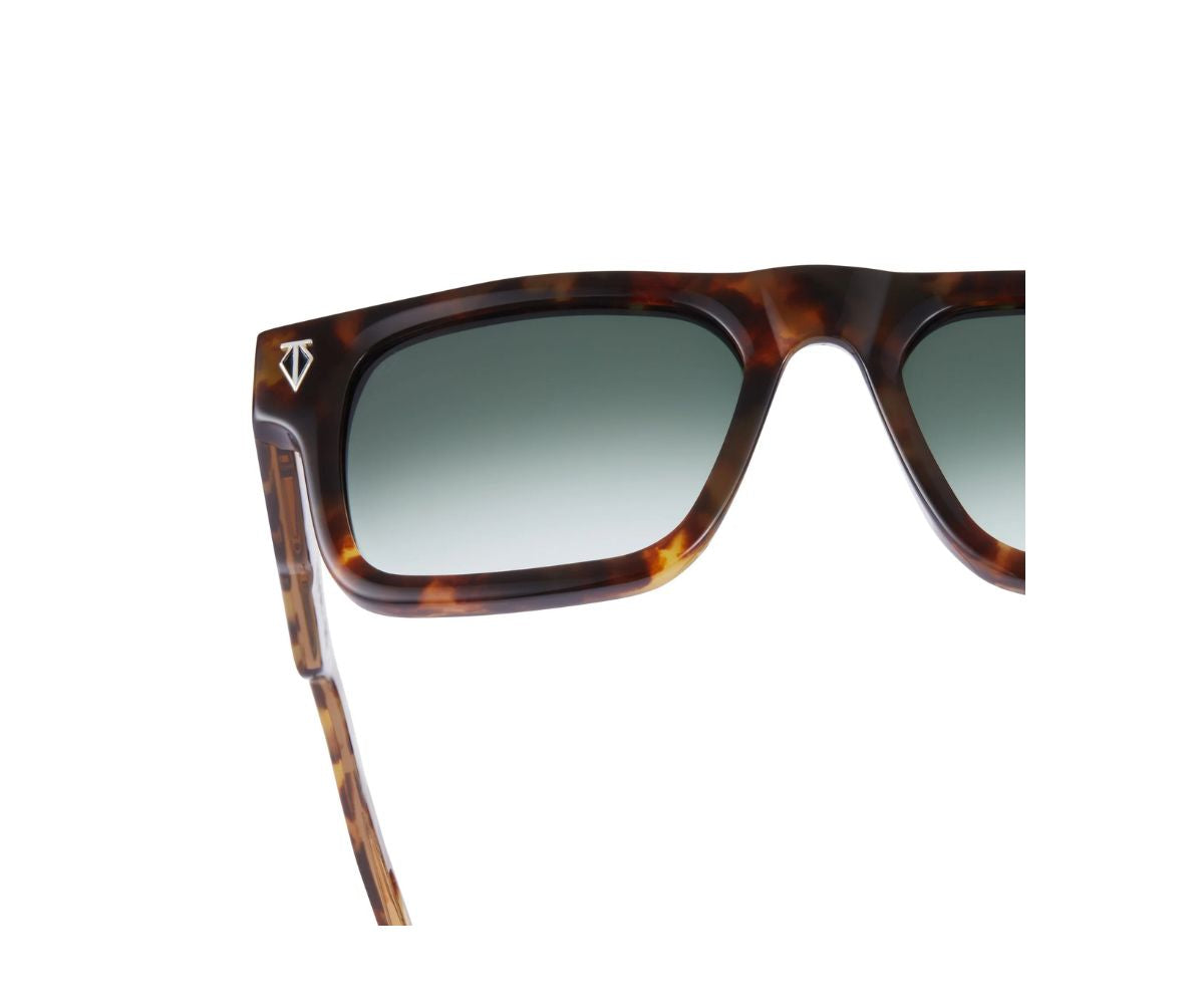 Sunglasses with tortoiseshell frame and dark lenses on a white background