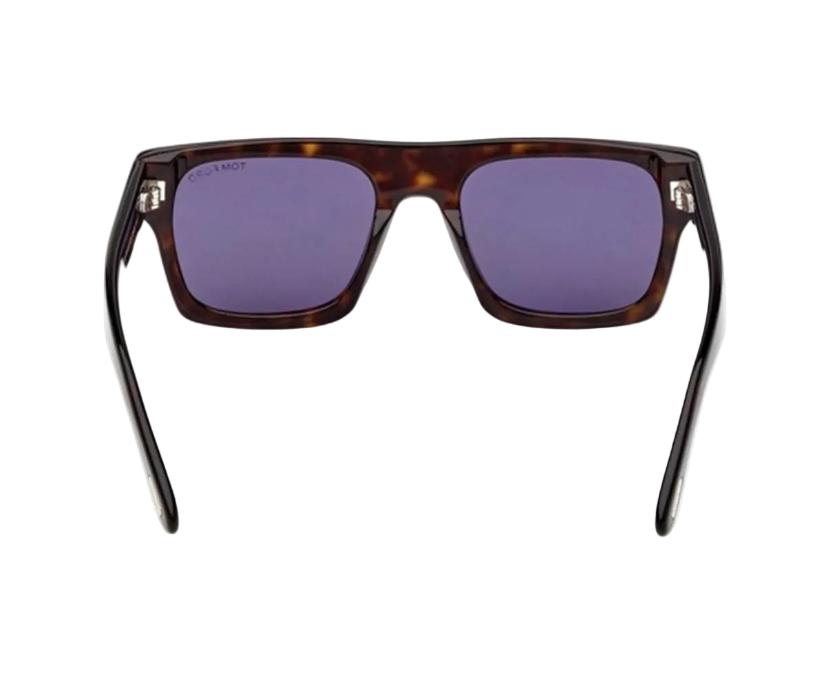 Sunglasses with tortoiseshell frame and purple lenses on a white background