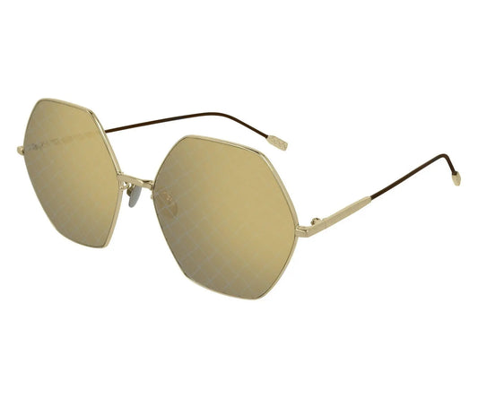 Gold sunglasses with a white background