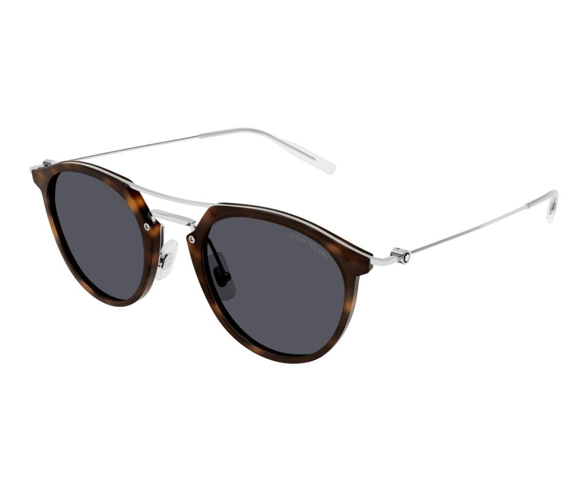 Sunglasses with tortoiseshell frame and dark lenses on a white background