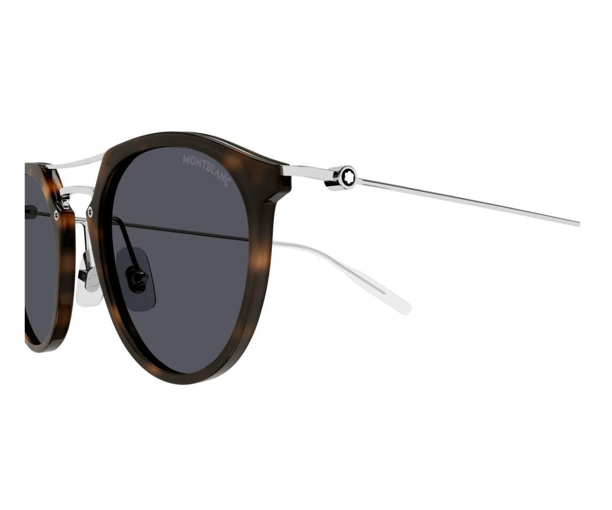 Sunglasses with tortoiseshell frame and dark lenses on a white background