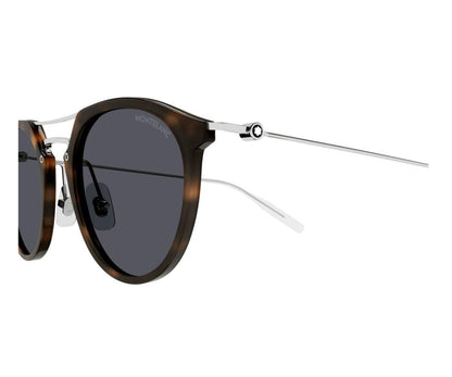 Sunglasses with tortoiseshell frame and dark lenses on a white background