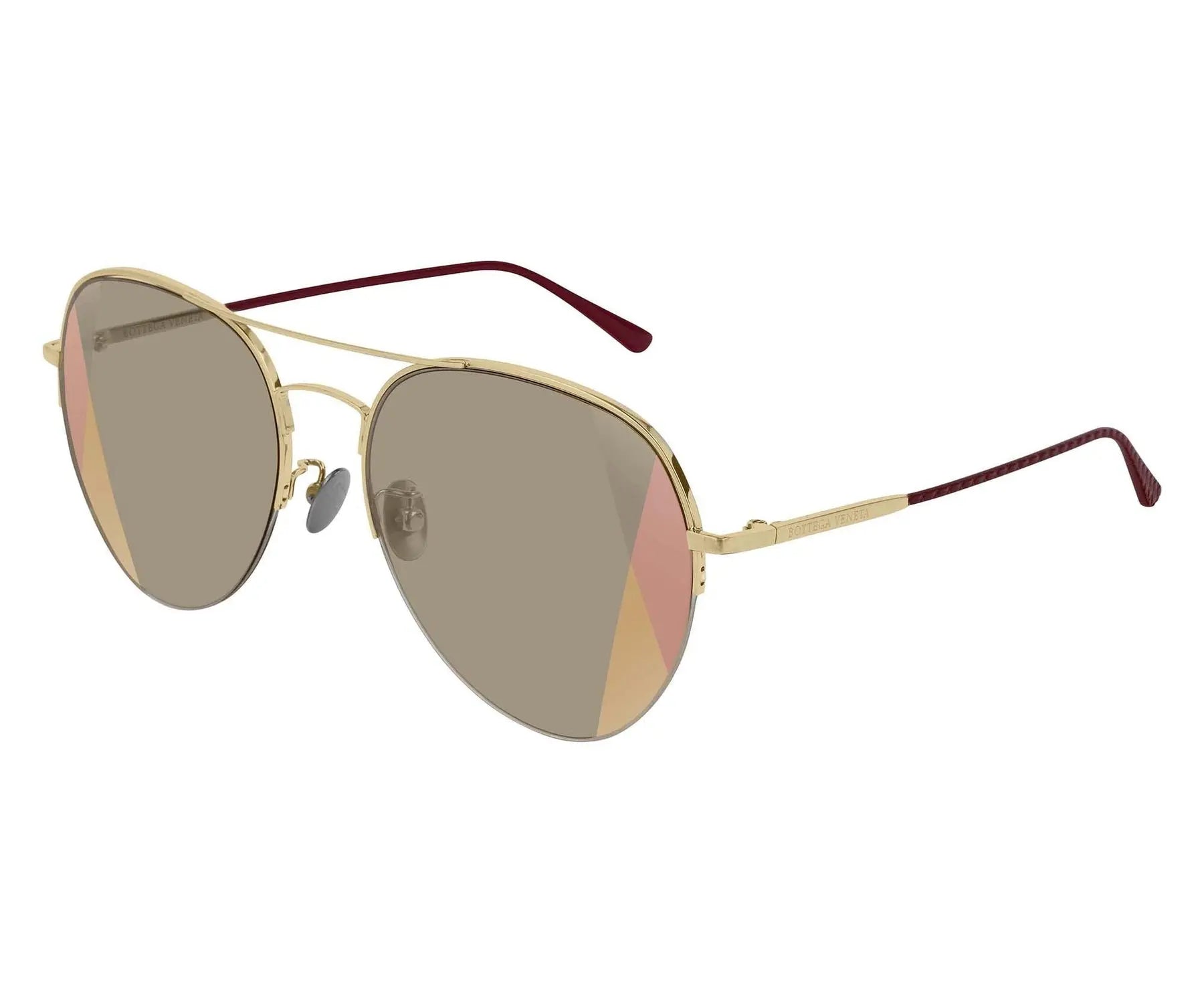 Gold-framed sunglasses with a white background