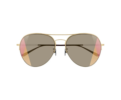 Aviator sunglasses with gold frame and dark lenses on a white background