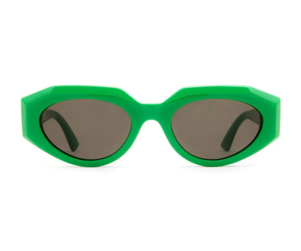 Green sunglasses with dark lenses on a white background