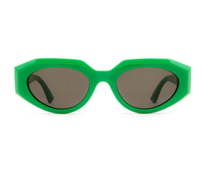 Green sunglasses with dark lenses on a white background