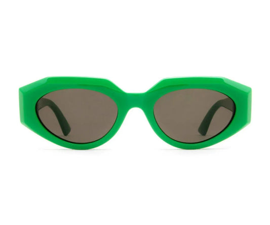 Green sunglasses with dark lenses on a white background