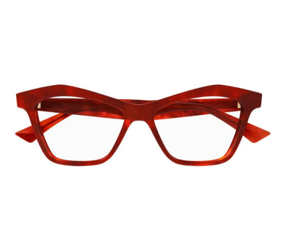 Red eyeglasses on a white background