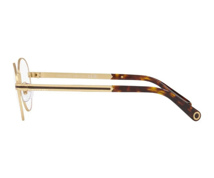 Gold and tortoiseshell eyeglasses on a white background