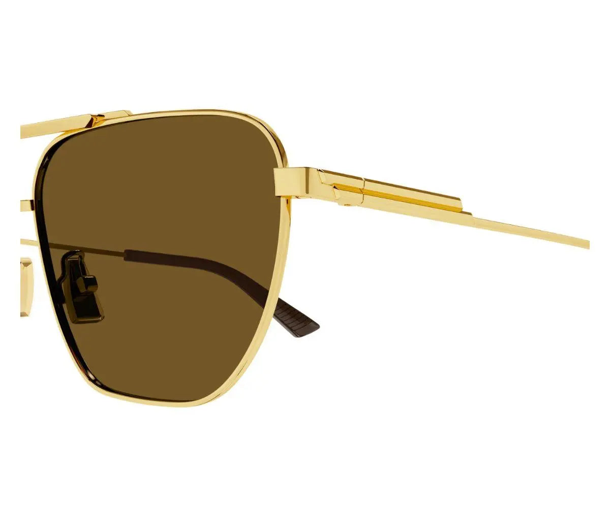 Gold-framed sunglasses with brown lenses on a white background