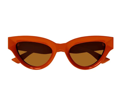 Orange cat-eye sunglasses with brown lenses on a white background
