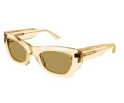 Gold cat-eye sunglasses on a white background
