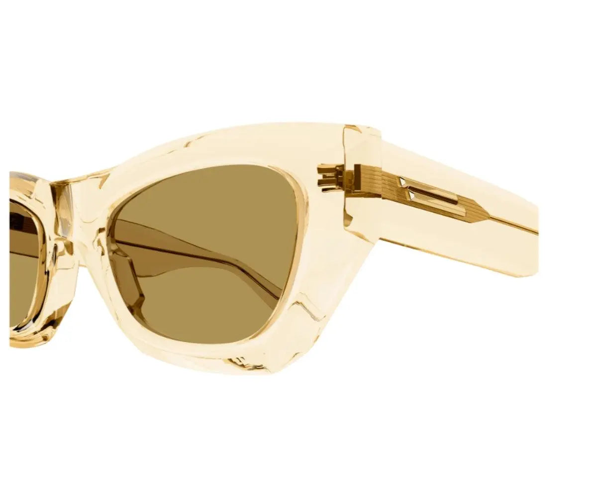 Gold sunglasses with a white background