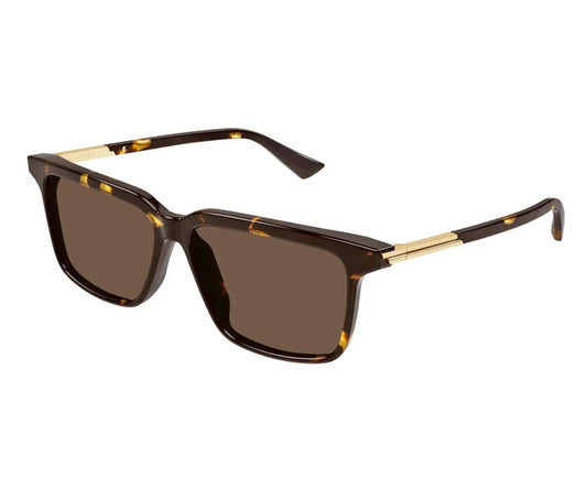 Sunglasses with tortoiseshell frame and brown lenses on a white background