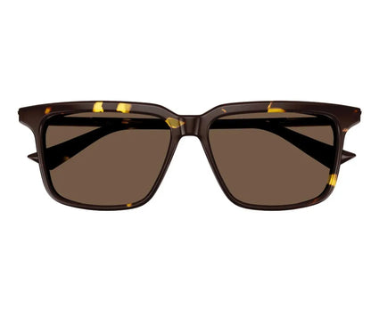 Sunglasses with a brown frame and dark lenses on a white background