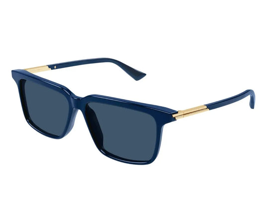 Blue sunglasses with gold accents on a white background